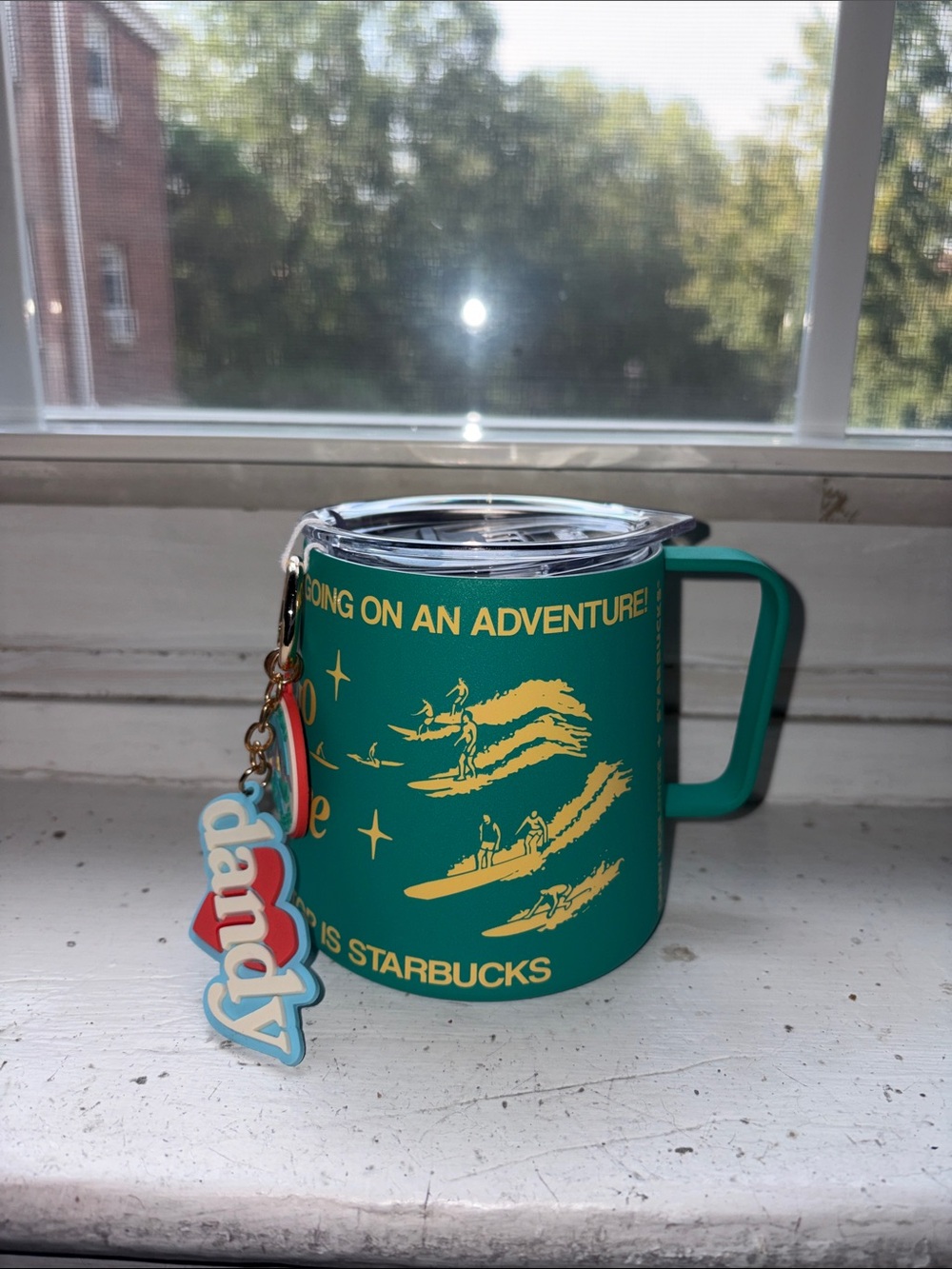 Starbucks Dandy green travel mug with yellow surf graphics and charm